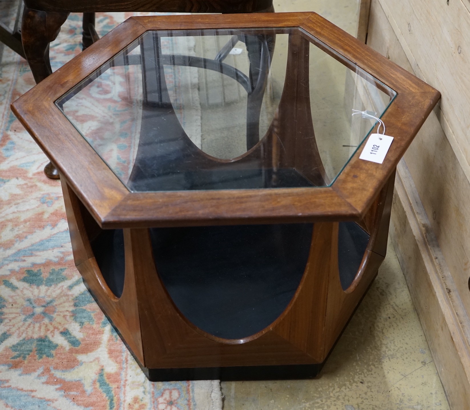 A mid century design hexagonal teak brass top coffee table, width 63cm, height 42cm